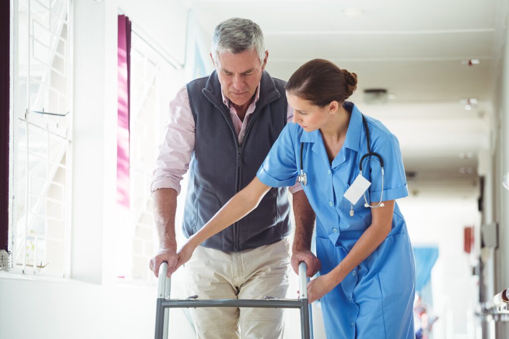 nurse helping patient walk